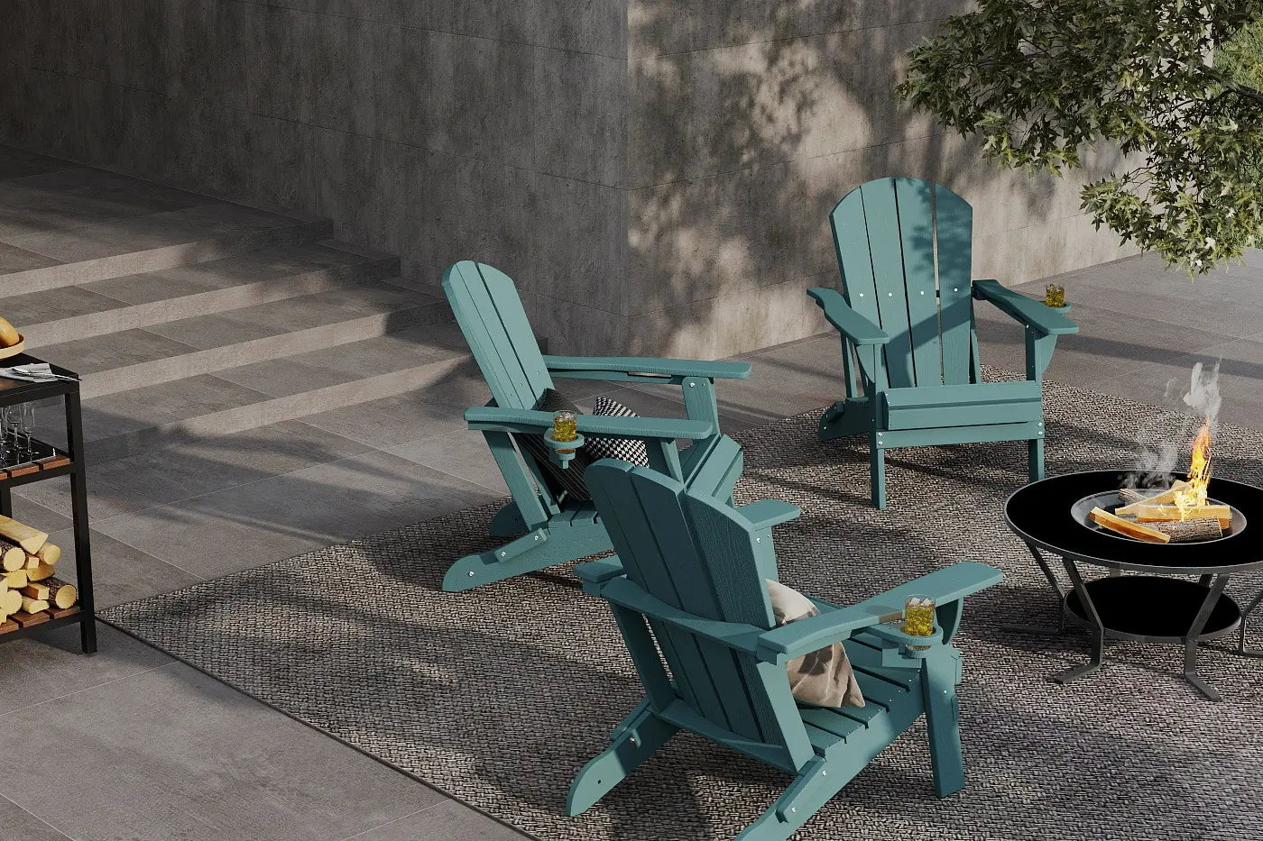 Three teal Adirondack chairs on a patio with a fire pit and outdoor decor.