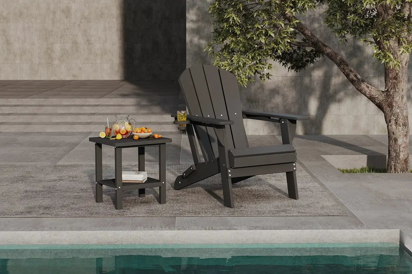 Black Adirondack chair and side table by a poolside with a tree in the background.