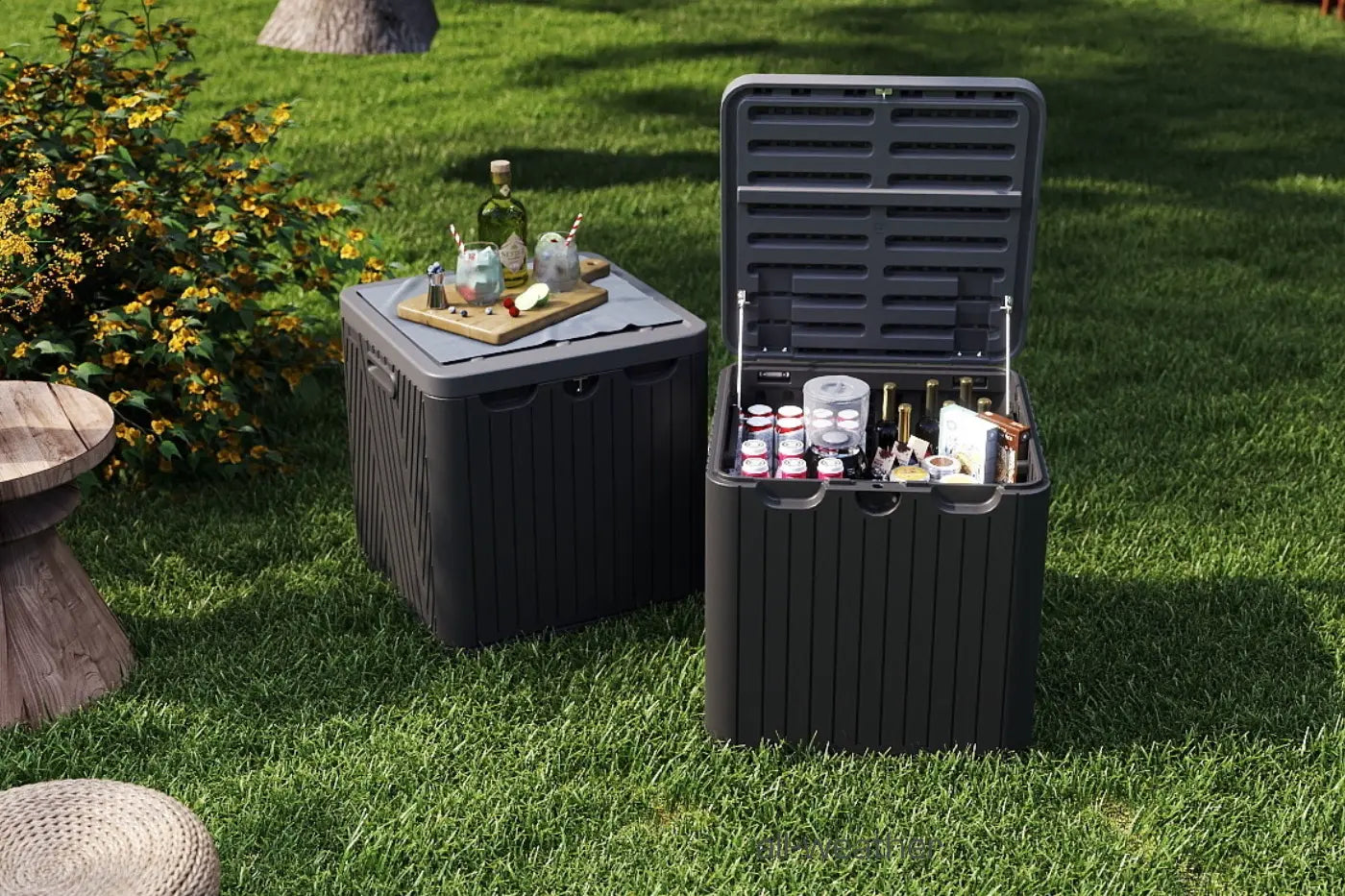 Two black storage boxes on grass with drinks and bottles inside