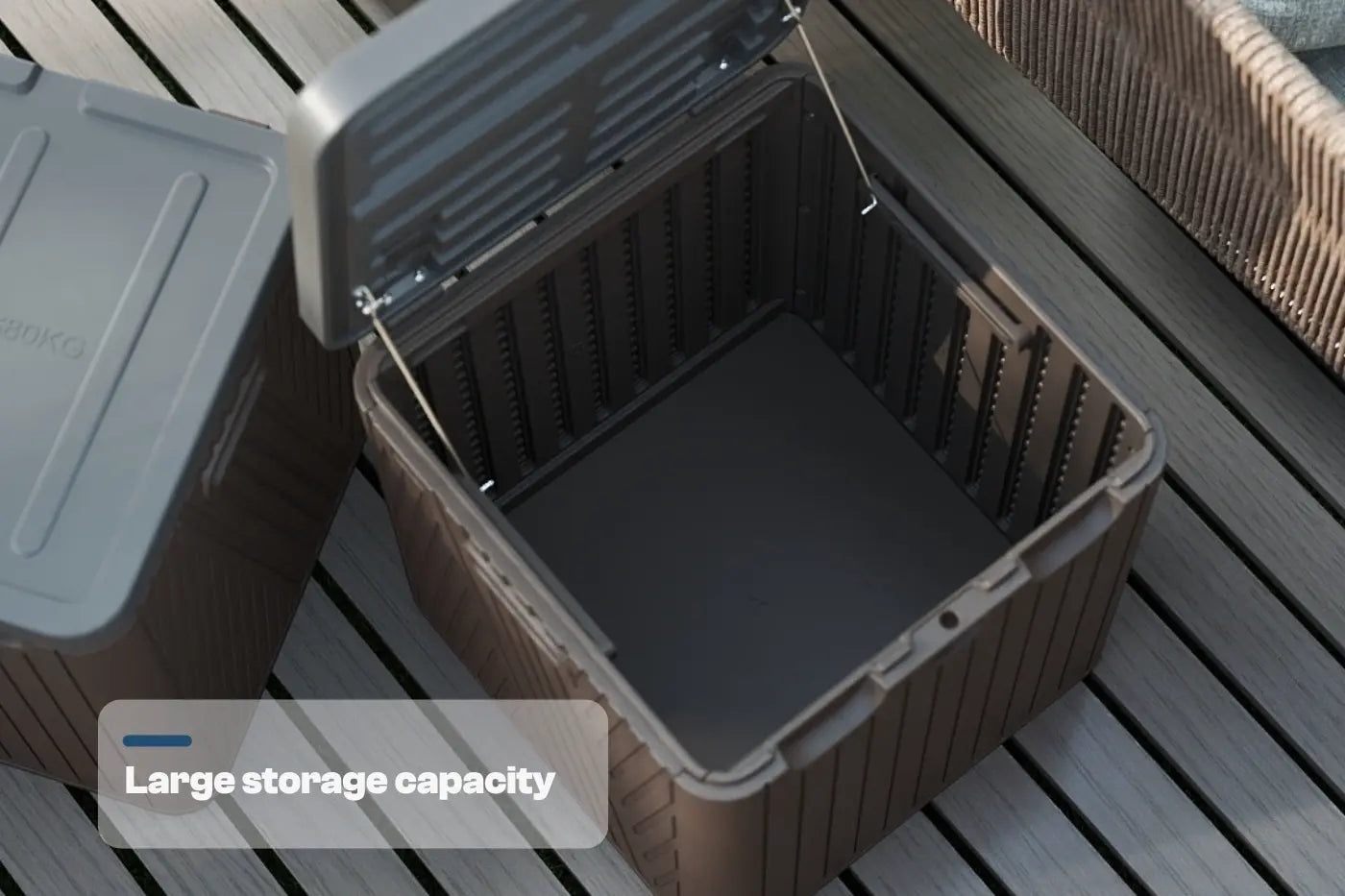 Brown storage bin with a gray lid on a wooden surface, labeled 'Large storage capacity'.