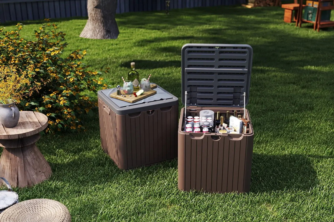 Two outdoor storage boxes on grass with drinks and snacks.