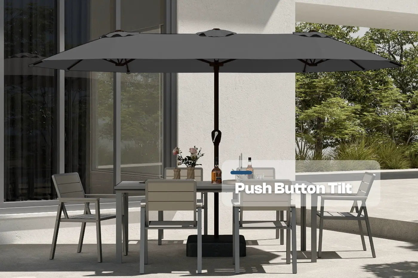 Outdoor patio set with table, chairs, and large umbrella on a patio.