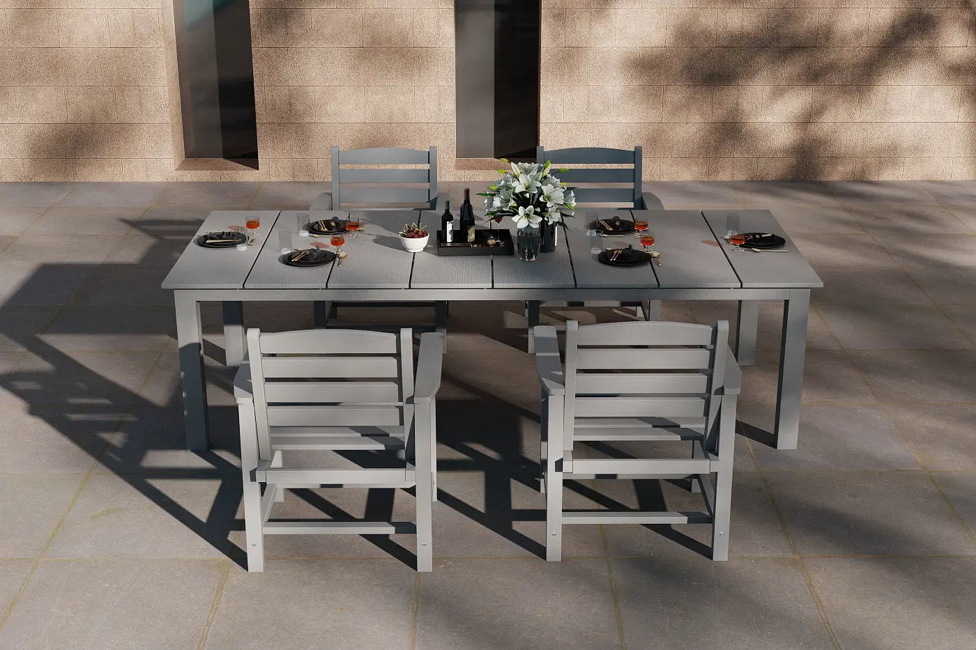 Outdoor dining set with a table and chairs on a patio.