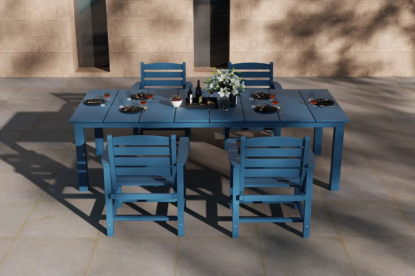 Blue outdoor dining set with table and chairs on a patio.