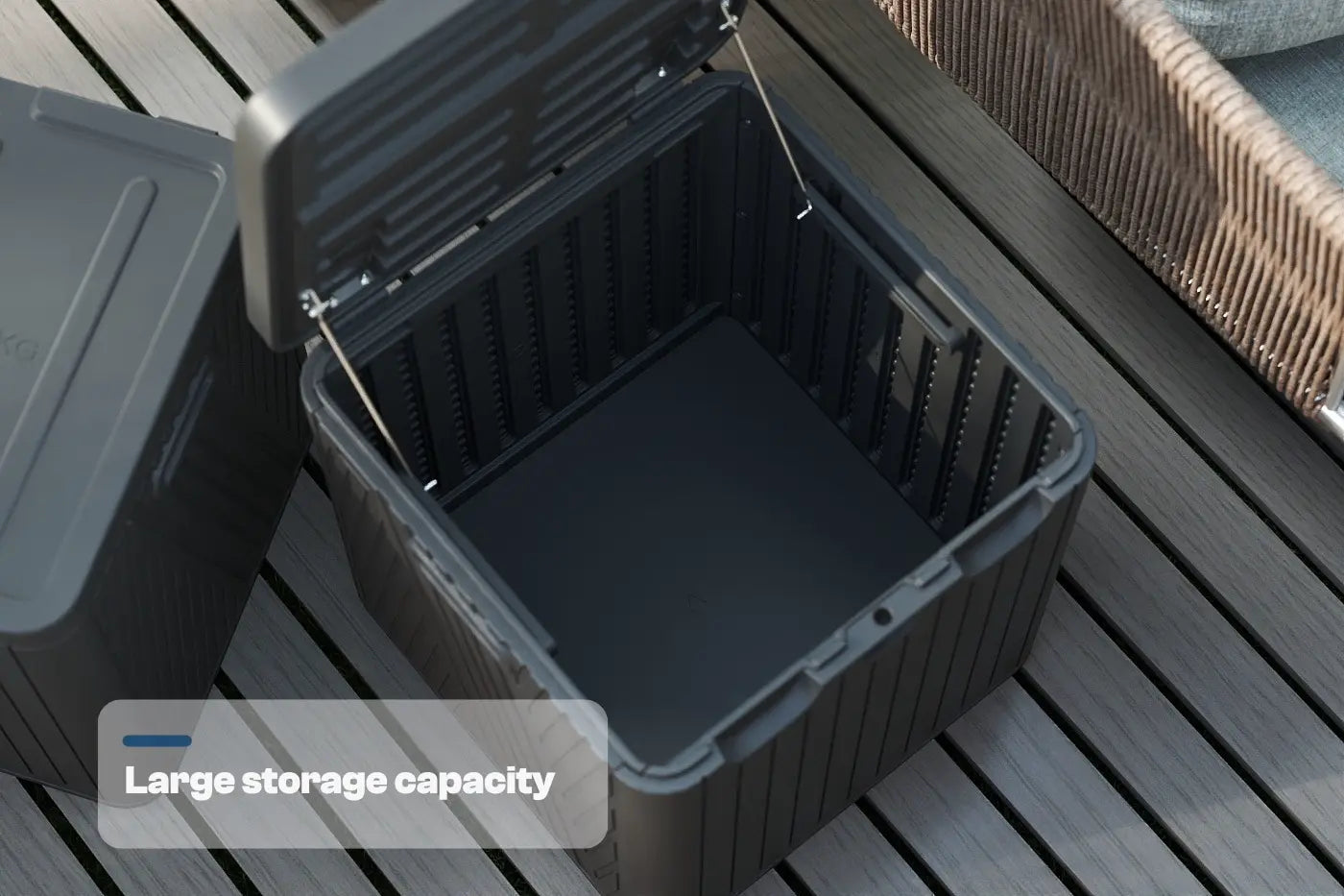 Black storage bin with lid on a wooden surface