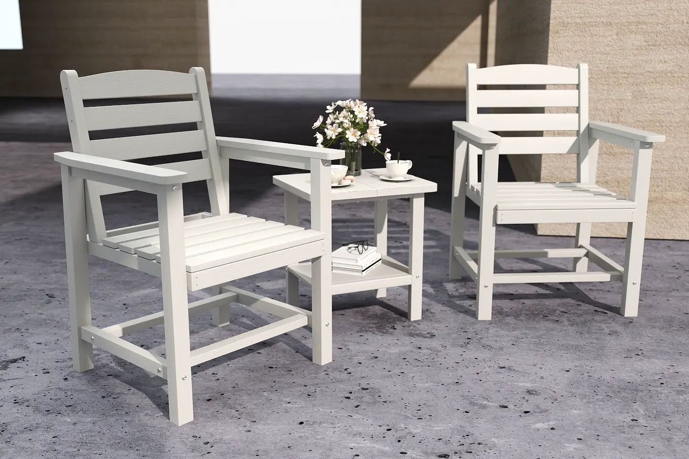 Two white wooden chairs with a small table on a concrete patio.