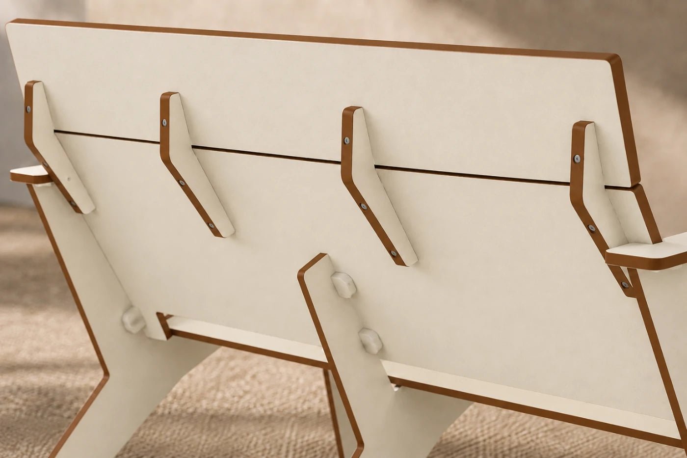 Close-up of a beige chair backrest showing the slatted seat, support brackets, and side armrests.