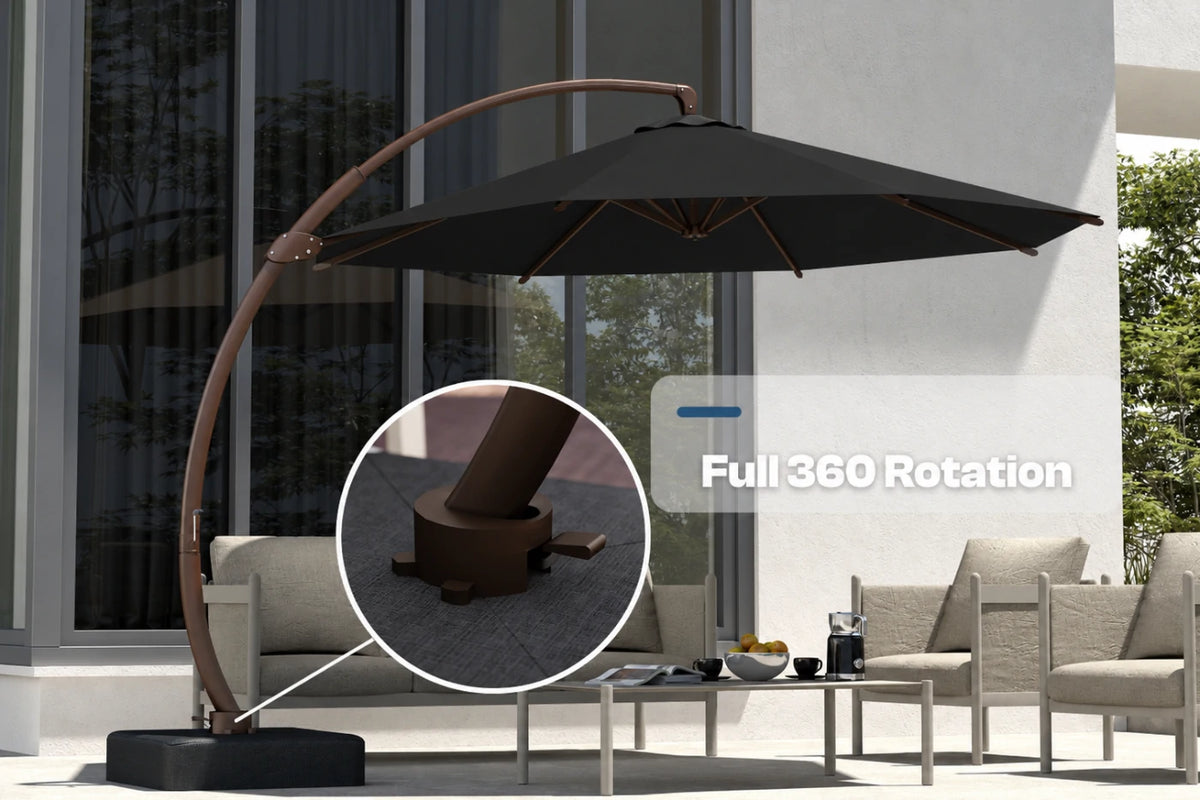 A large outdoor cantilever patio umbrella with a black canopy and brown curved frame, shown beside modern patio furniture. The image includes a circular inset highlighting the base mechanism and text reading 'Full 360 Rotation.