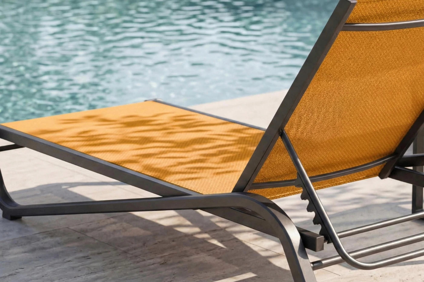 Orange lounge chair by a pool
