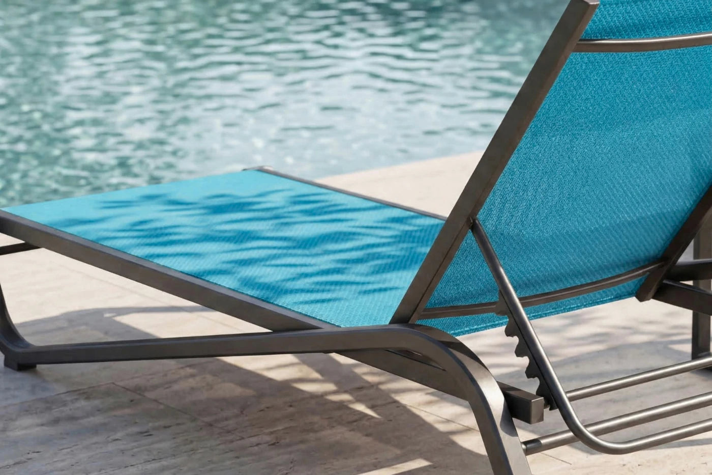 Blue lounge chair by a pool