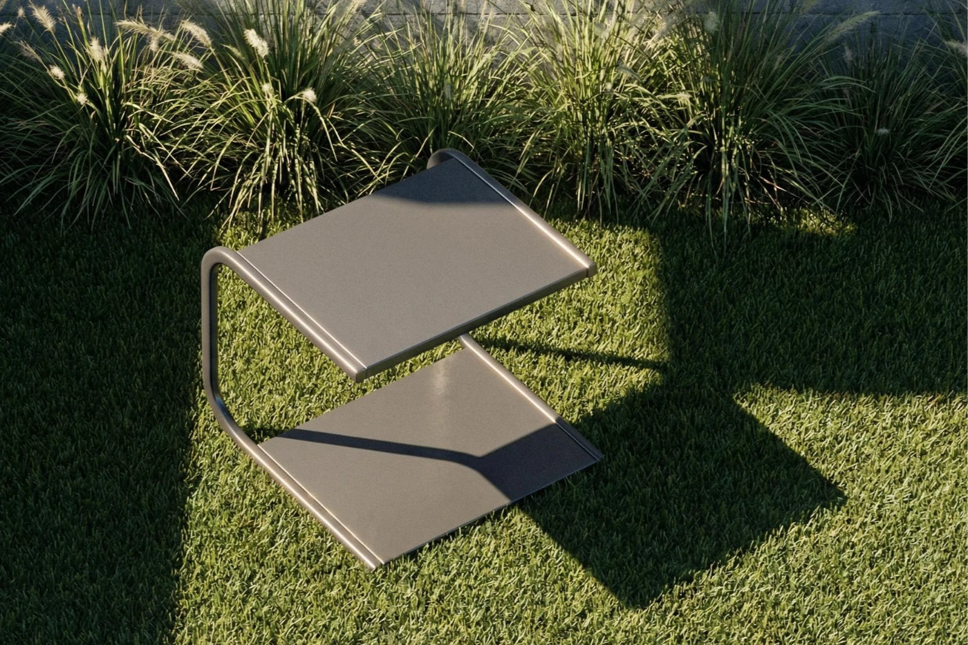 Modern outdoor chair on grass with plants in the background