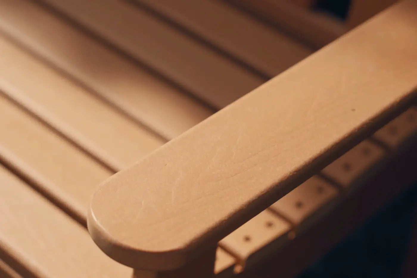 Close-up of a wooden chair with a blurred background