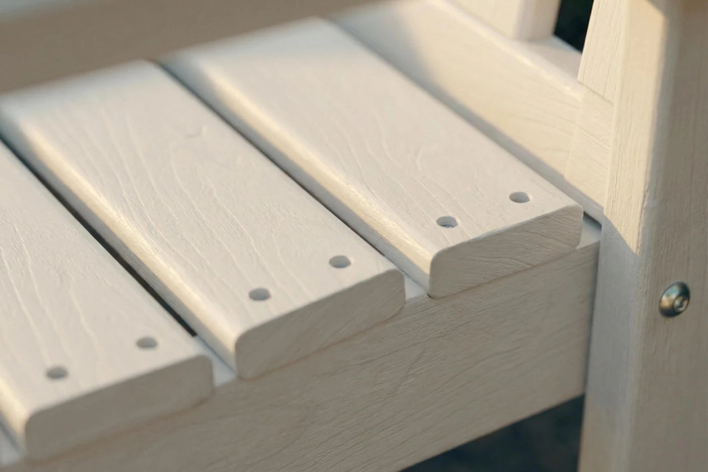 Close-up of a wooden bench with visible screws.