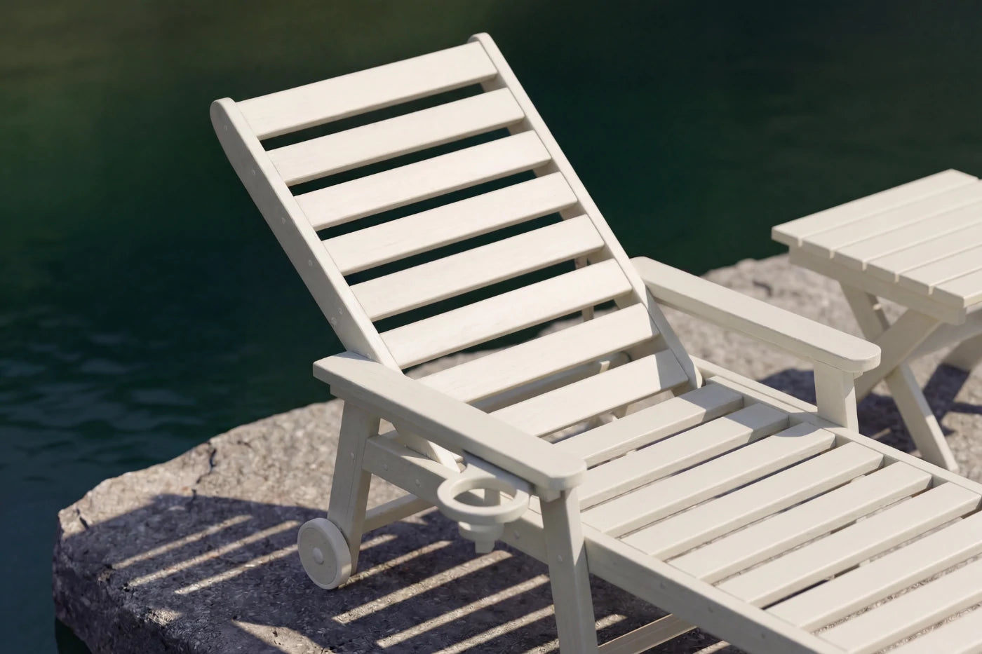 White lounge chair by a body of water