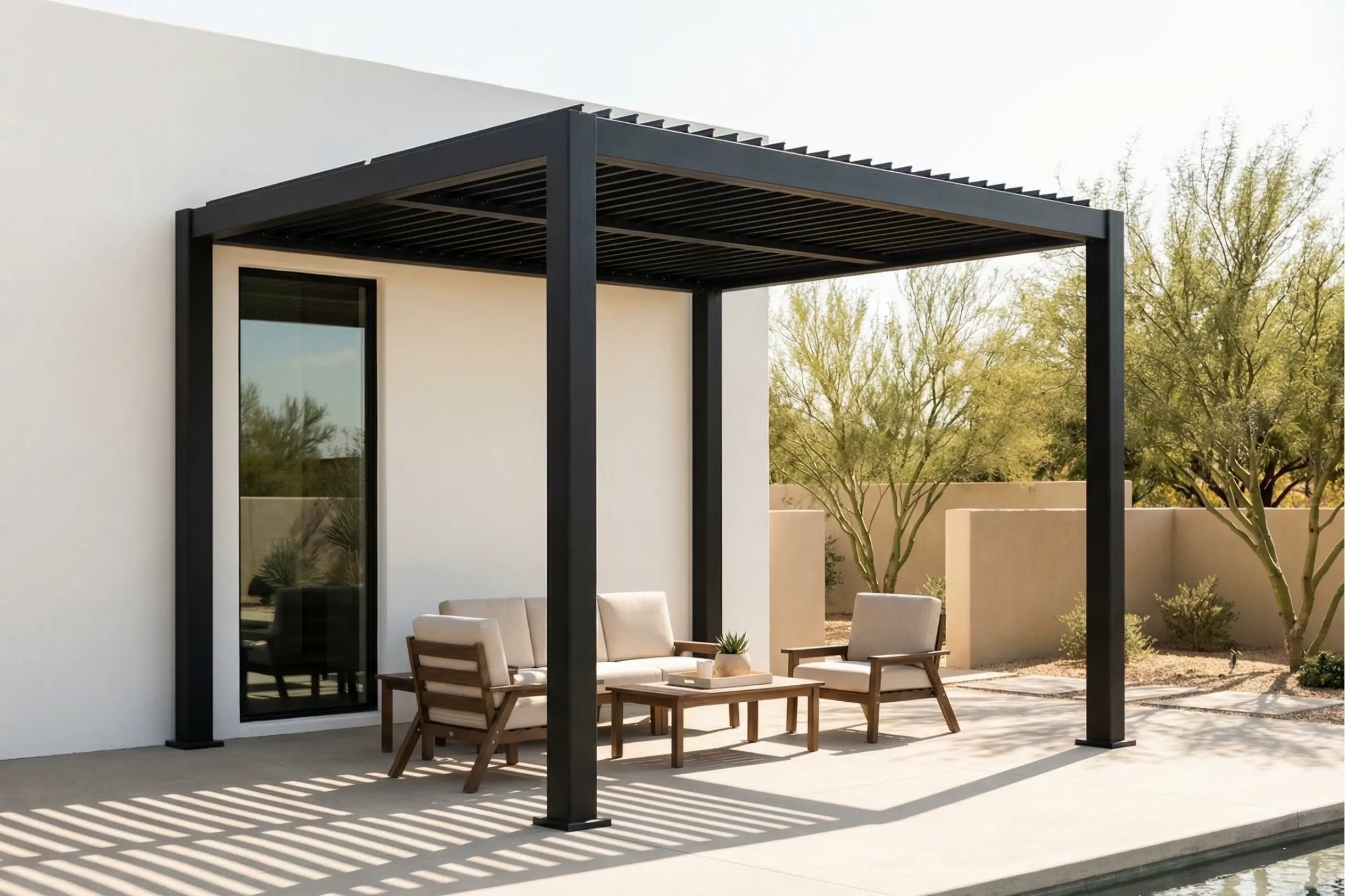 Outdoor patio with louvered pergola, furniture, and desert landscape