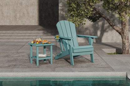 Teal Adirondack chair and side table by a poolside with a tree in the background.
