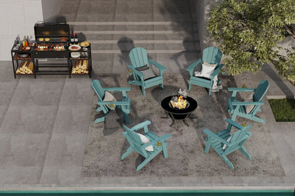 Outdoor patio setup with teal chairs, grill, and fire pit on a concrete patio.