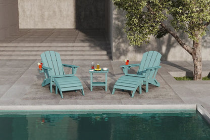 Two teal Adirondack chairs with a small table by a poolside.