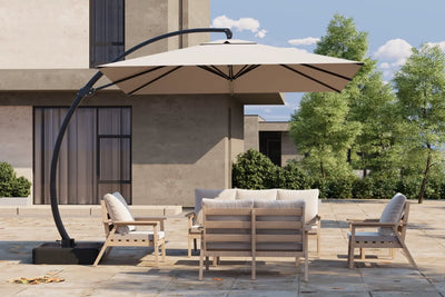 Outdoor patio set with a large umbrella on a patio area.