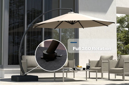 Beige patio umbrella with 360-degree rotation feature on a patio setting.