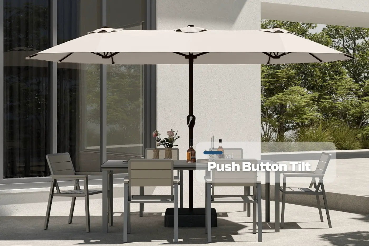 Outdoor patio set with table, chairs, and large umbrella on a modern patio.