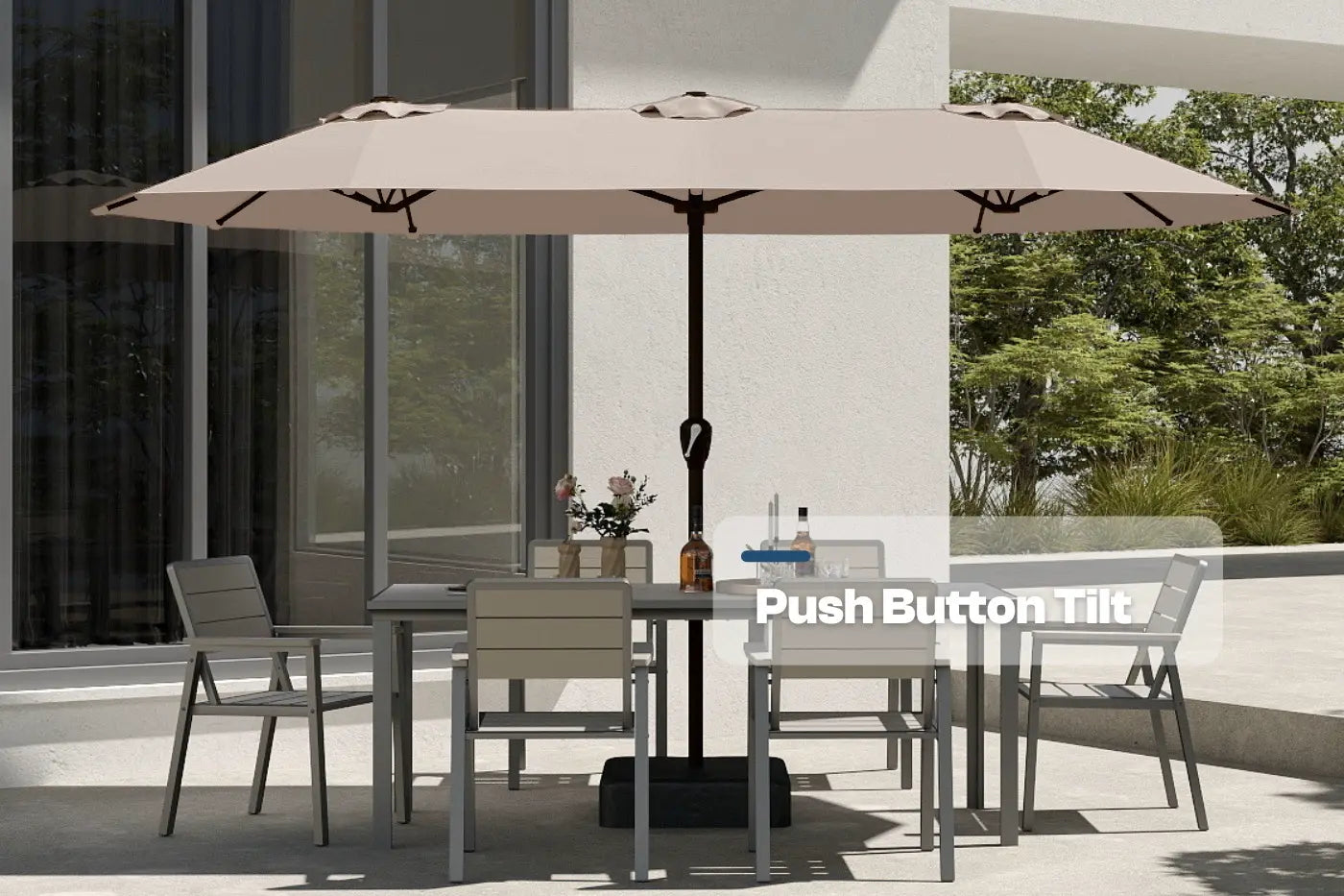 Outdoor patio set with a large umbrella on a modern patio.