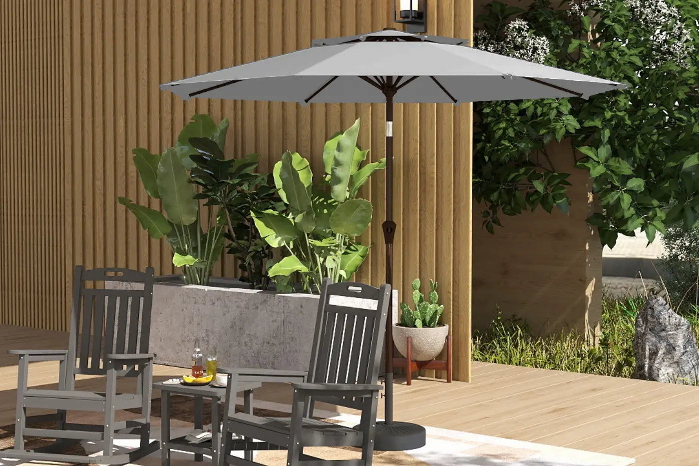 Outdoor patio set with chairs, table, and umbrella on a wooden deck.