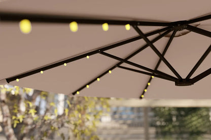 Close-up of a patio umbrella with string lights against a blurred outdoor background