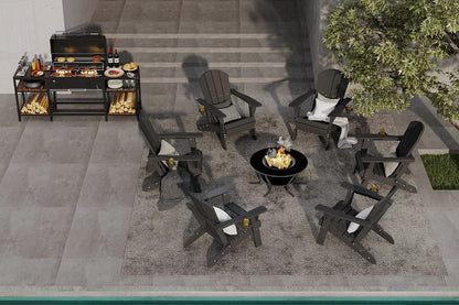 Outdoor patio setup with black Adirondack chairs, grill, and fire pit on a stone patio.