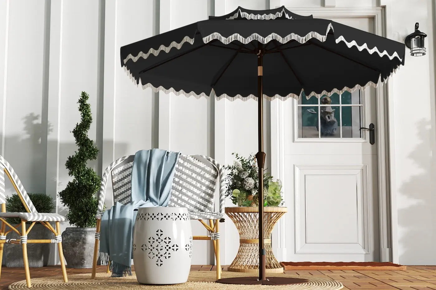 Black patio umbrella with white trim on a wooden deck