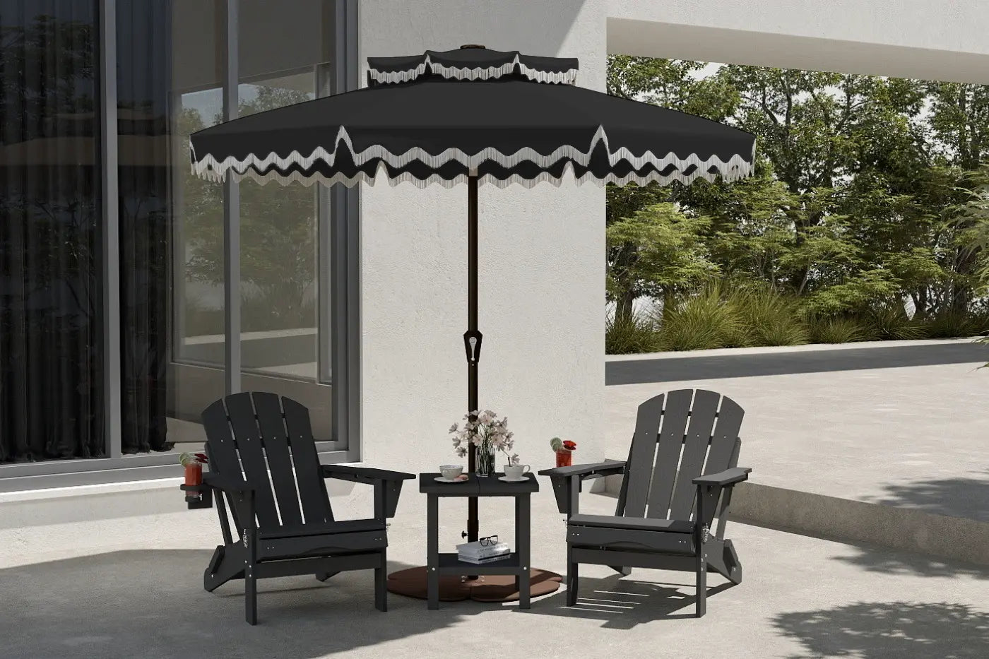 Outdoor patio set with two chairs and a small table under a large black umbrella with white trim, on a patio with trees in the background.
