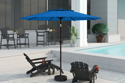 Blue patio umbrella on a stand in an outdoor setting with chairs and a pool.