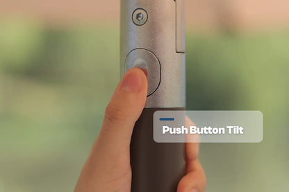 Hand holding a camera with 'Push Button Tilt' feature labeled