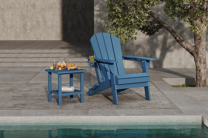 Blue Adirondack chair and side table by a poolside with a tree in the background.