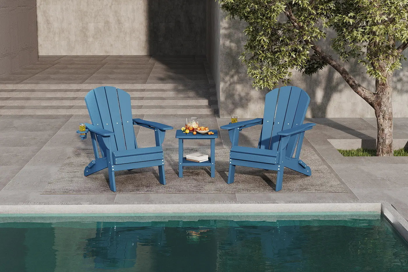 Two blue Adirondack chairs with a small table by a poolside.
