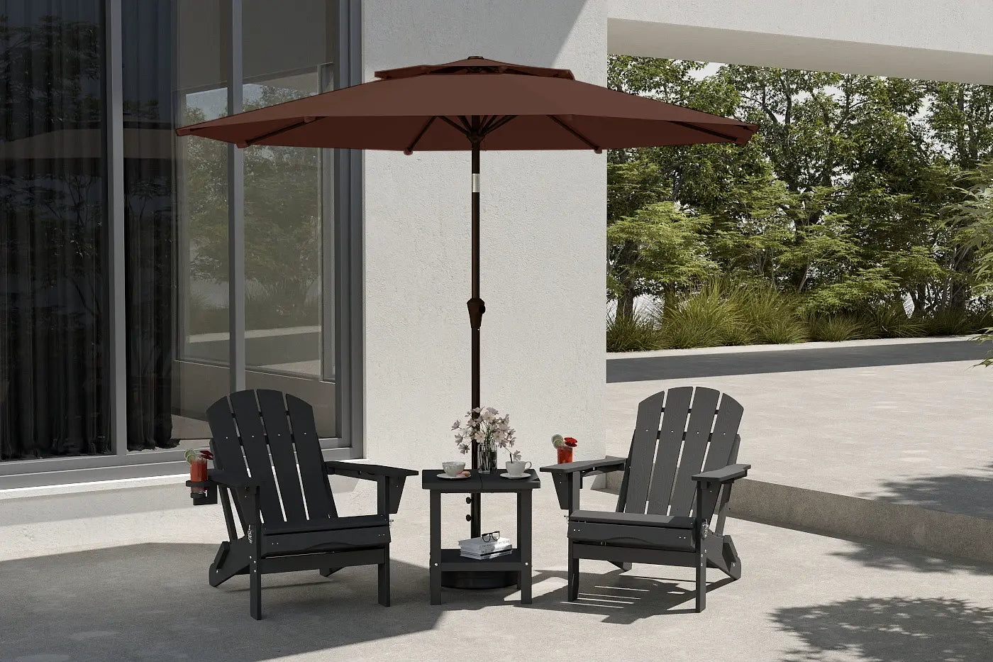 Patio set with two black chairs and a table under a brown umbrella, outdoors.