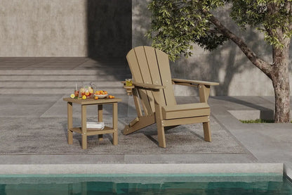 Wooden Adirondack chair and side table by a poolside with a tree in the background.