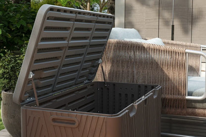 Outdoor trash bin with open lid on a patio