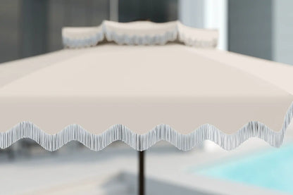 Clear plastic sheet with wavy edge on a stand against a blurred background