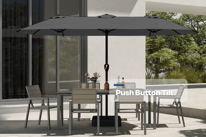 Outdoor patio set with table, chairs, and large umbrella on a patio.