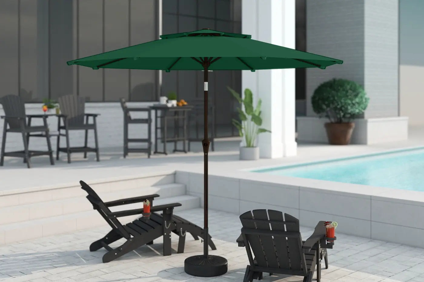 Green patio umbrella on a stand in an outdoor setting with chairs and a pool.