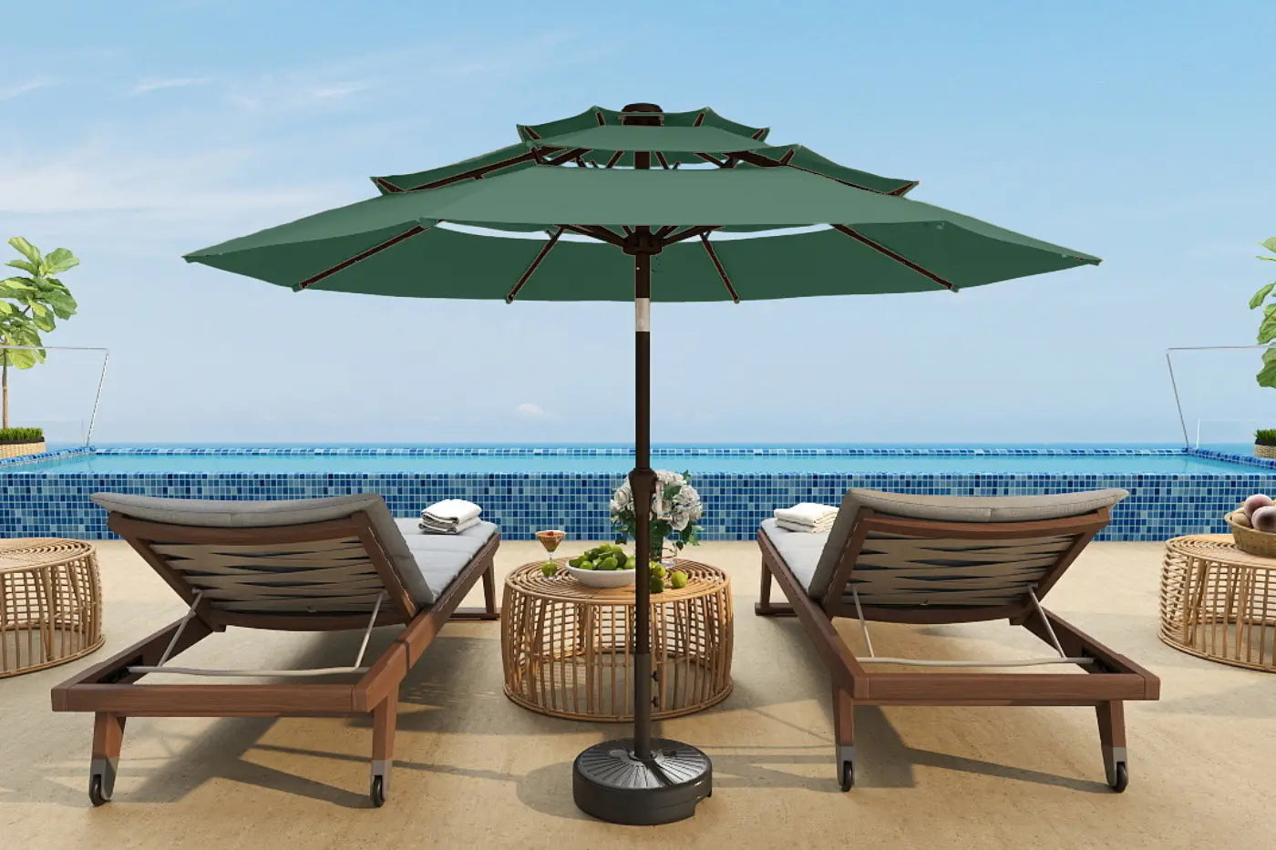 Outdoor patio set with two lounge chairs and a large green umbrella on a sunny day.