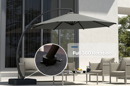 Outdoor patio umbrella with 360-degree rotation feature in a garden setting.