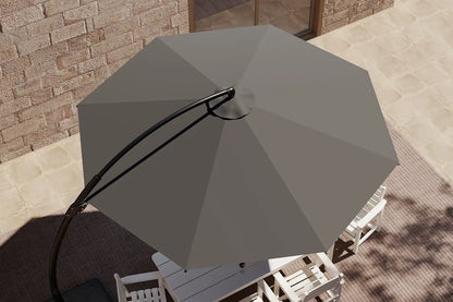 Gray outdoor umbrella on a patio with a brick wall background