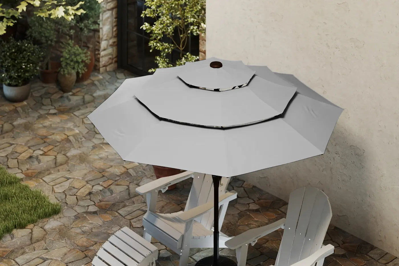 Gray patio umbrella on a stand with white chairs in a garden setting