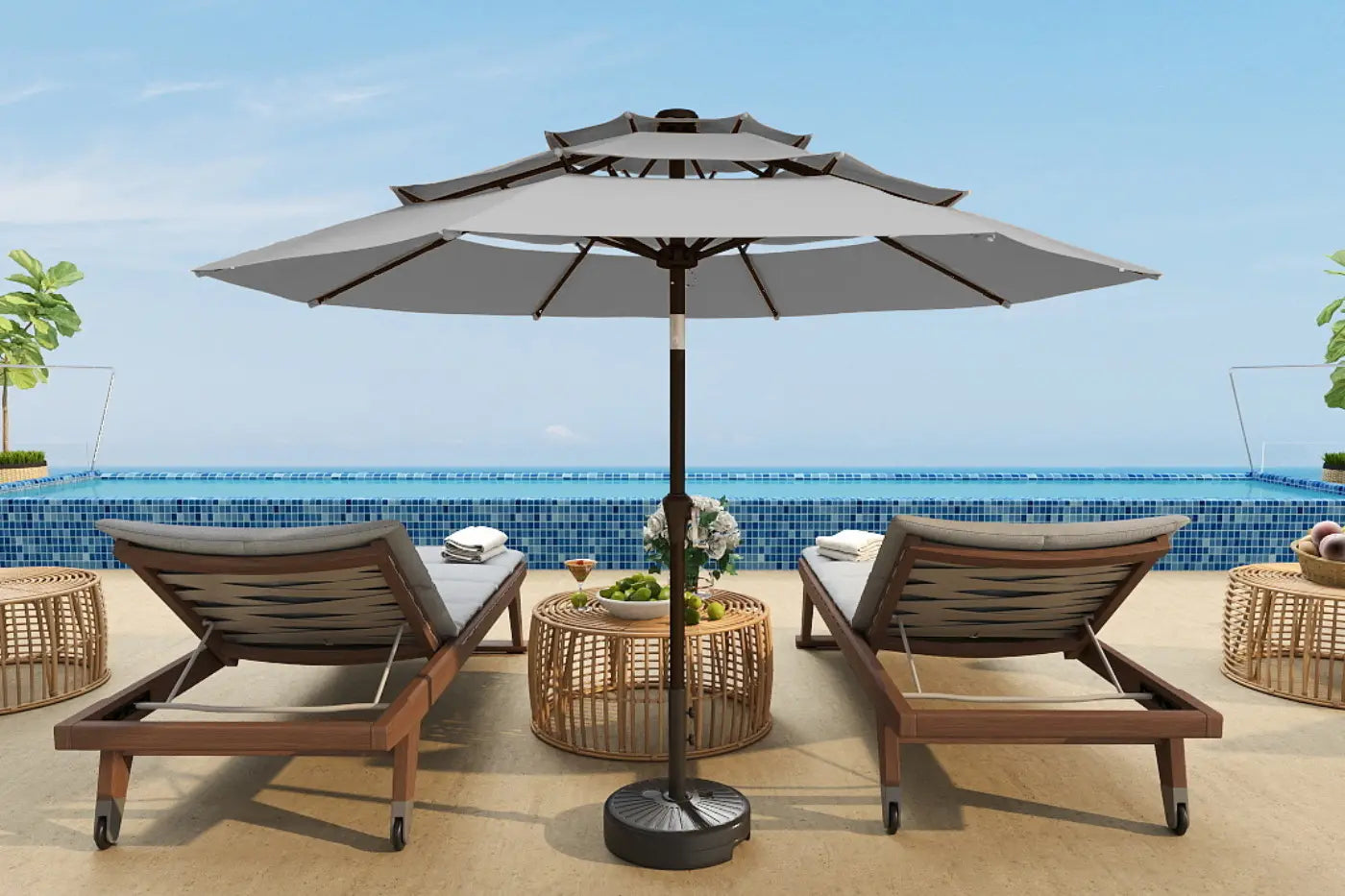 Outdoor patio set with two lounge chairs and a large umbrella by a pool.