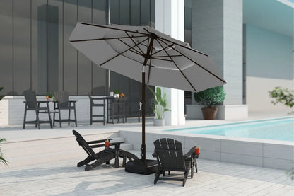 Outdoor patio setting with a large umbrella, chairs, and a pool in the background.