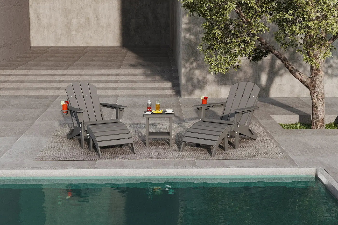 Two gray outdoor chairs by a pool with drinks on a small table.