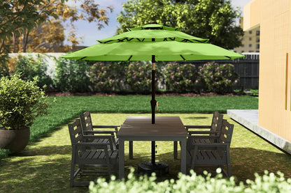 Outdoor patio set with a green umbrella on a grassy area
