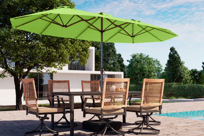 Outdoor dining set with a green umbrella by a poolside